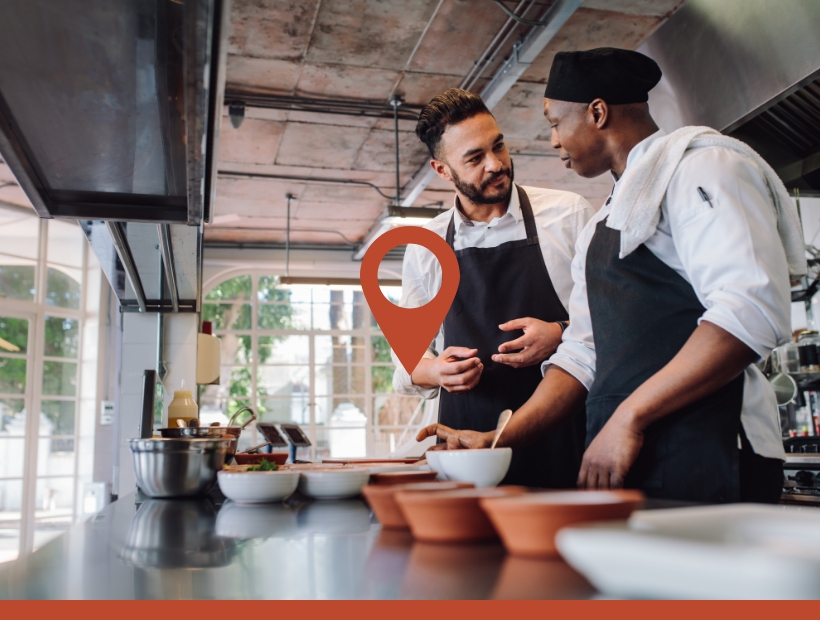 Two chefs working in a kitchen