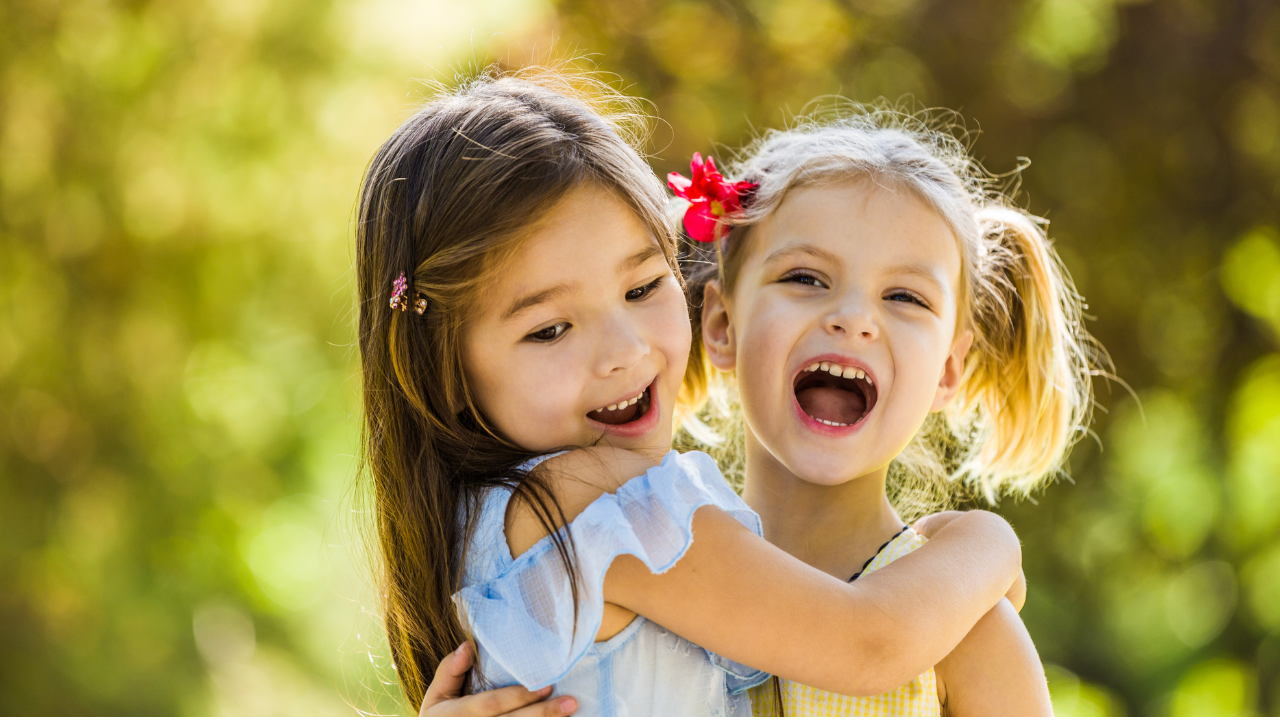 Two children sitting and playing together