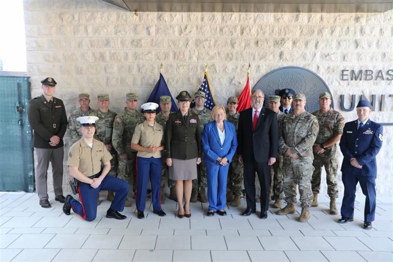 Governor Mills, Major General Dunn, Chargé d’affaires A.I. Keays, and members of Maine National Guard and U.S. Embassy staff.