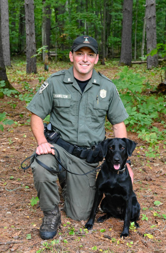 Warden Kayle Hamilton and K9 Ash