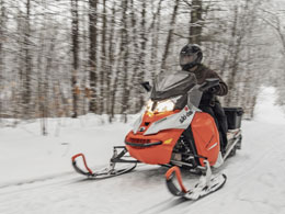 Snowmobiles on a trail